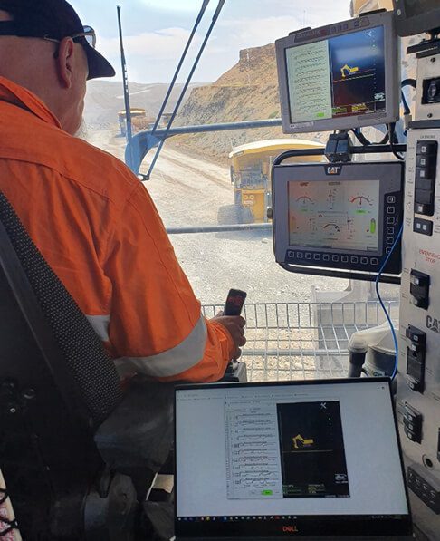 Mining operator using automation and control systems inside heavy equipment