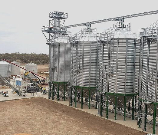 Industrial facility with silos and electrical infrastructure supporting commercial and rural operations