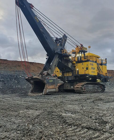 Large mining excavator operating at an open-cut mining site